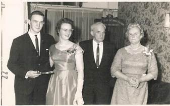 Robertson/Webber family — four people at a formal social event: young man in dark suit, young woman in formal dress with corsage, older man, older woman in floral dress, c.1960s