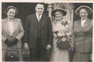 Robertson/Webber family — four people in formal 1940s attire outside a church, two women, one man, one woman