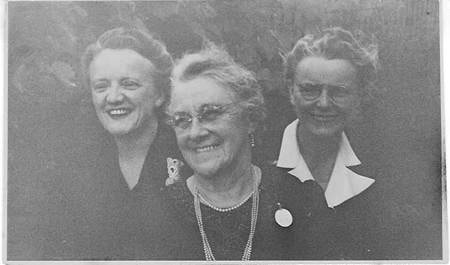 Robertson/Webber family — three women outdoors laughing and smiling together, c.1950s–1960s