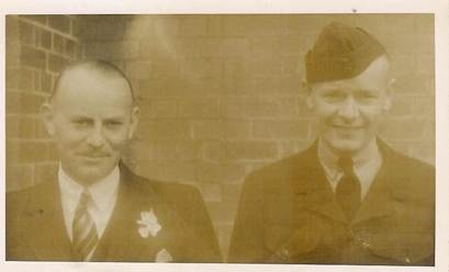 Robertson/Webber family — two men in formal attire, one with buttonhole flower, one in military cap, brick wall behind, c.1940s