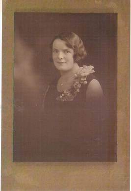 Robertson/Webber family woman in dark dress with corsage at shoulder, sepia studio portrait, c.1920s–1930s