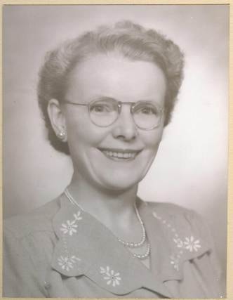 Robertson/Webber family woman, glasses, pearl necklace, embroidered collar, colour portrait photograph, c.1950s–1960s
